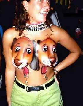 picture of a woman with two puppies painted onto her breats